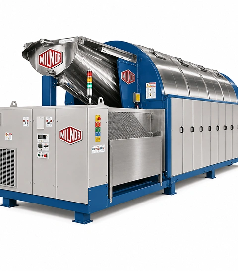 Milnor PBW 76039 PulseFlow continuous batch washer full length view with pump skid and control cabinet