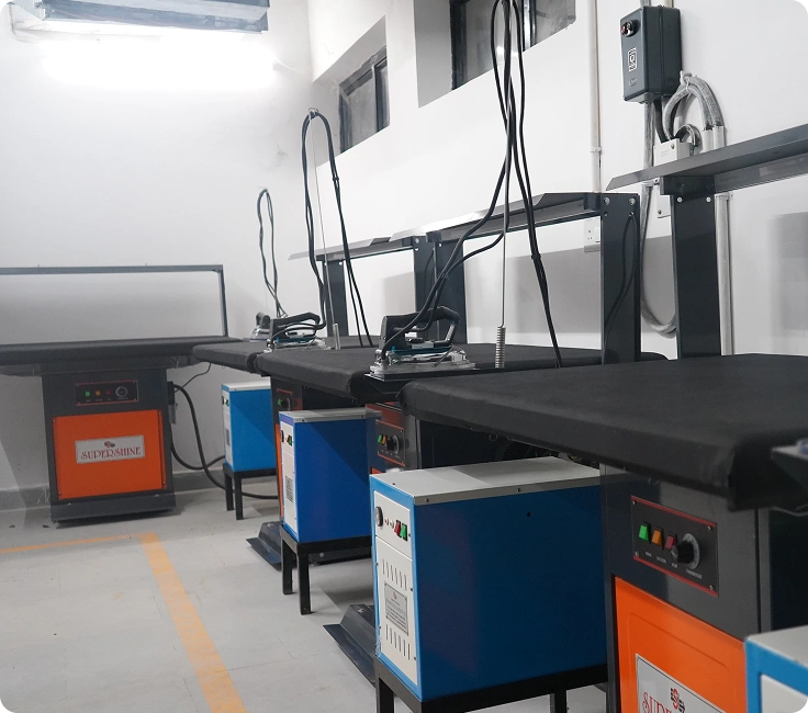 Supershine vacuum ironing tables set up at Lady Hardinge Medical College and Hospital's laundry facility, New Delhi