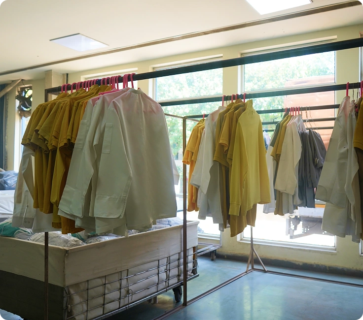 Central Linen Park Bhiwadi Processed Hotel Uniforms And Staff Garments On Finishing Racks