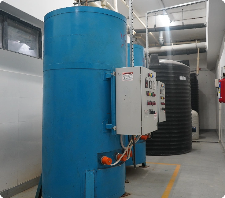 Industrial boilers and water storage tanks powering the laundry operations at Lady Hardinge Medical College and Hospital, New Delhi