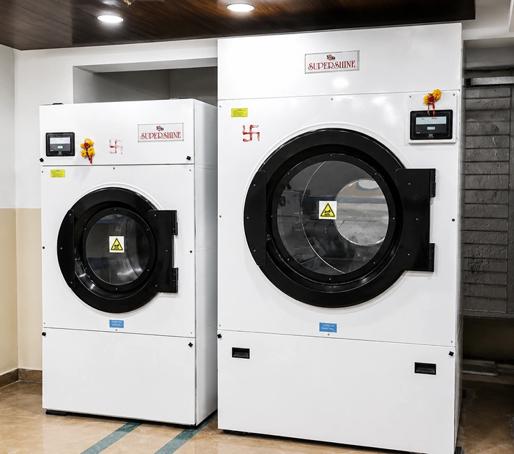 LG commercial stacked washer dryer units installed at Damodar Dham guest house laundry facility Nathdwara Rajasthan